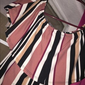 I am selling a nude ,black ,white , and red shirt.